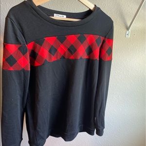 black sweater with red plaid